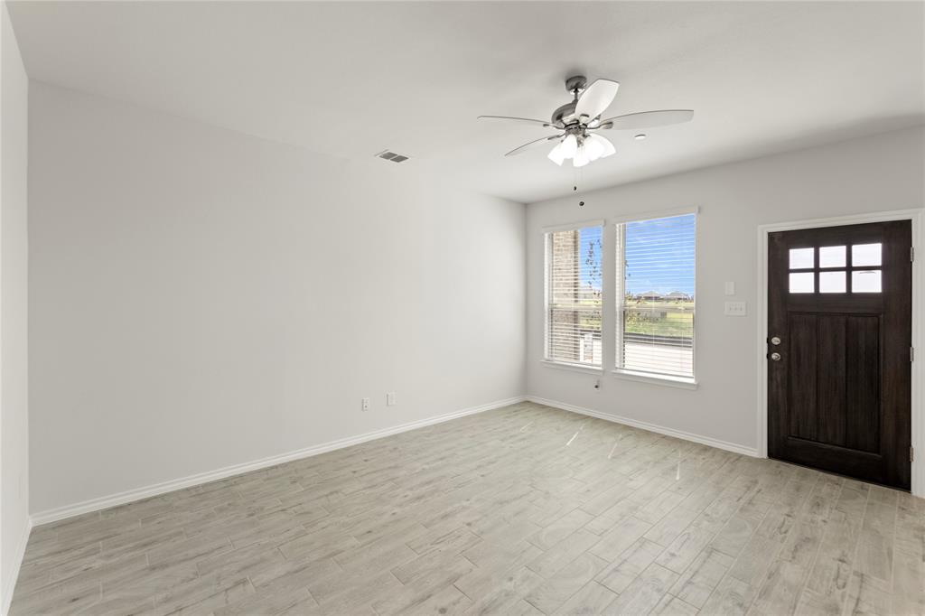 5414 East Runnel Road Royse City, TX 75189 - Photo 4 of 26 wooden floor in an empty room with a window