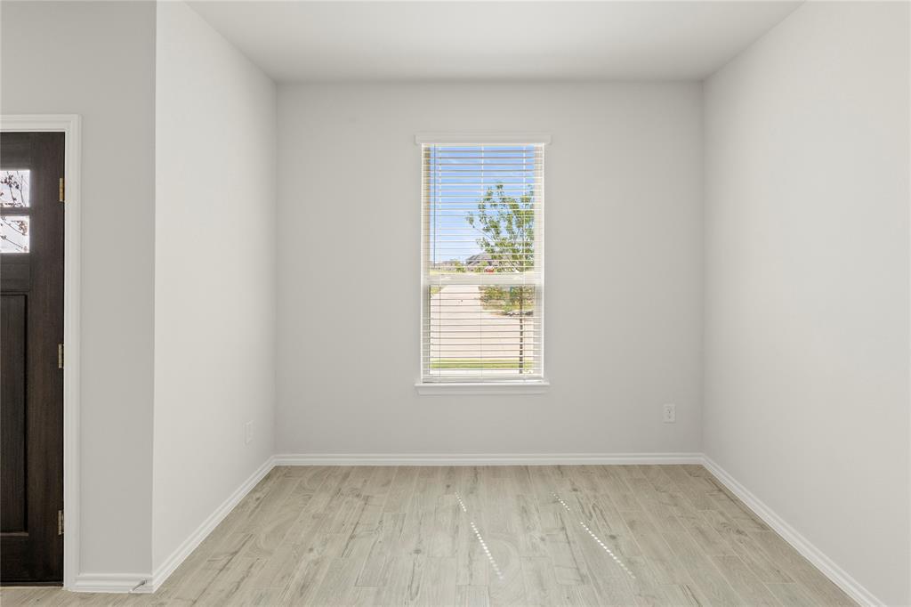 5414 East Runnel Road Royse City, TX 75189 - Photo 7 of 26 an empty room with a window