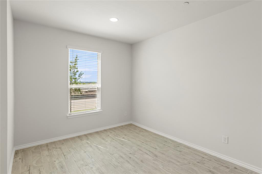 5414 East Runnel Road Royse City, TX 75189 - Photo 8 of 26 an empty room with a window