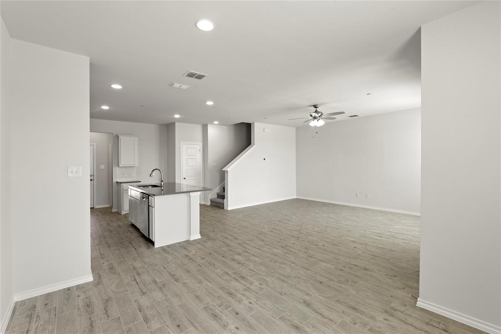 5414 East Runnel Road Royse City, TX 75189 - Photo 9 of 26 a view of kitchen and hall with wooden floor