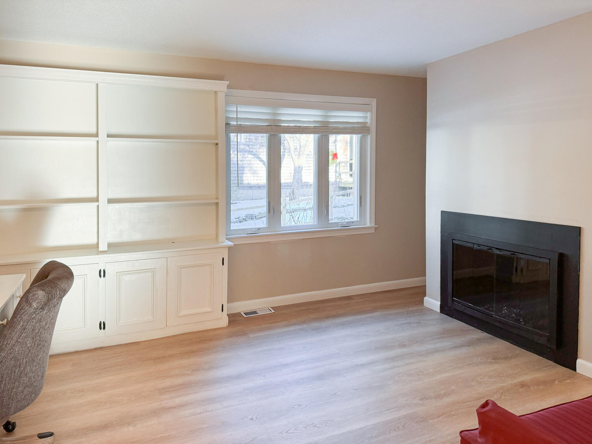 225 SW Meadows, Unit 225 Teaticket, MA 02536 - Photo 11 of 27 a view of an empty room with a window and wooden floor