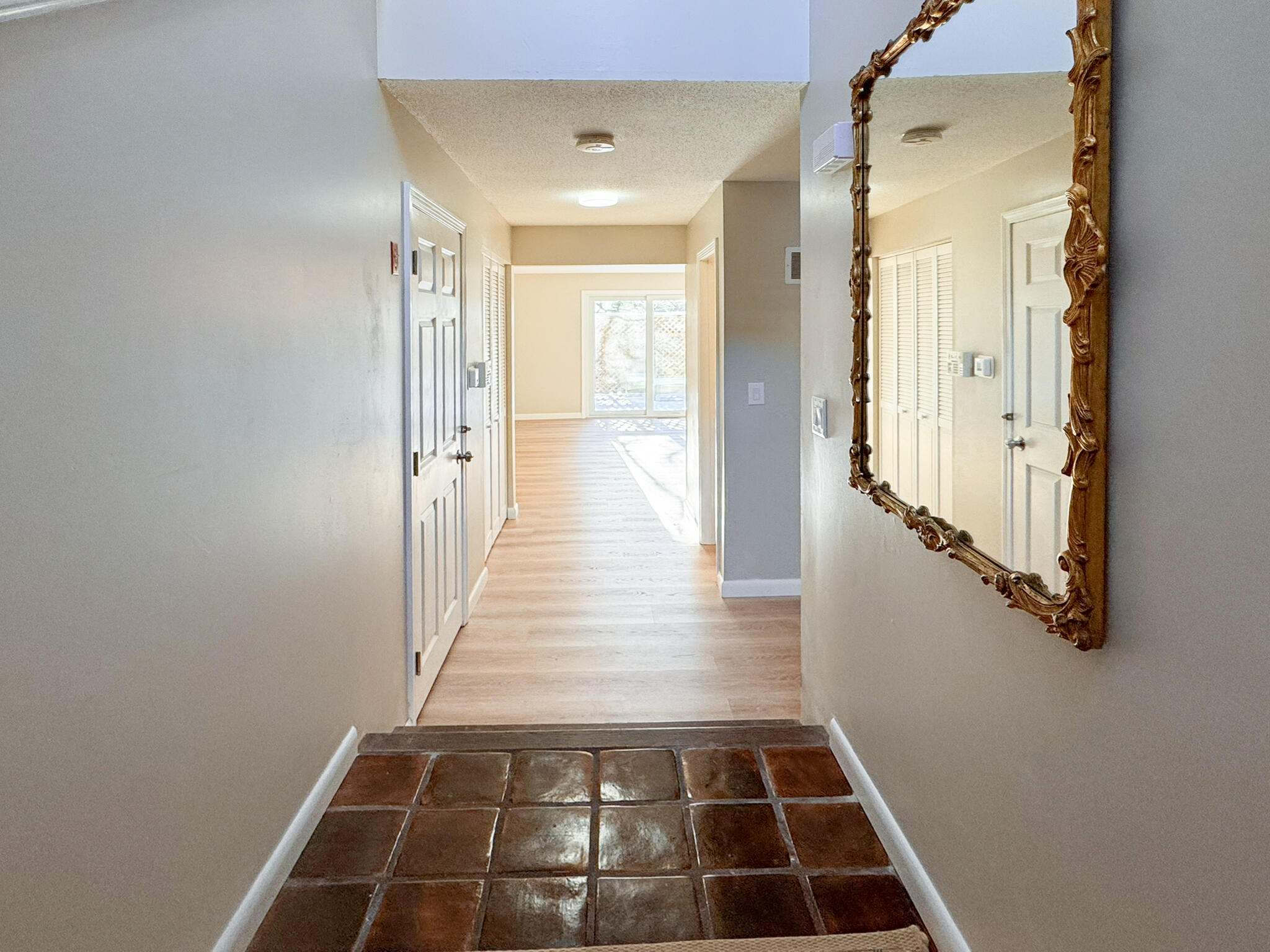 225 SW Meadows, Unit 225 Teaticket, MA 02536 - Photo 14 of 27 a view of a hallway with white walls and a black door in a corridor