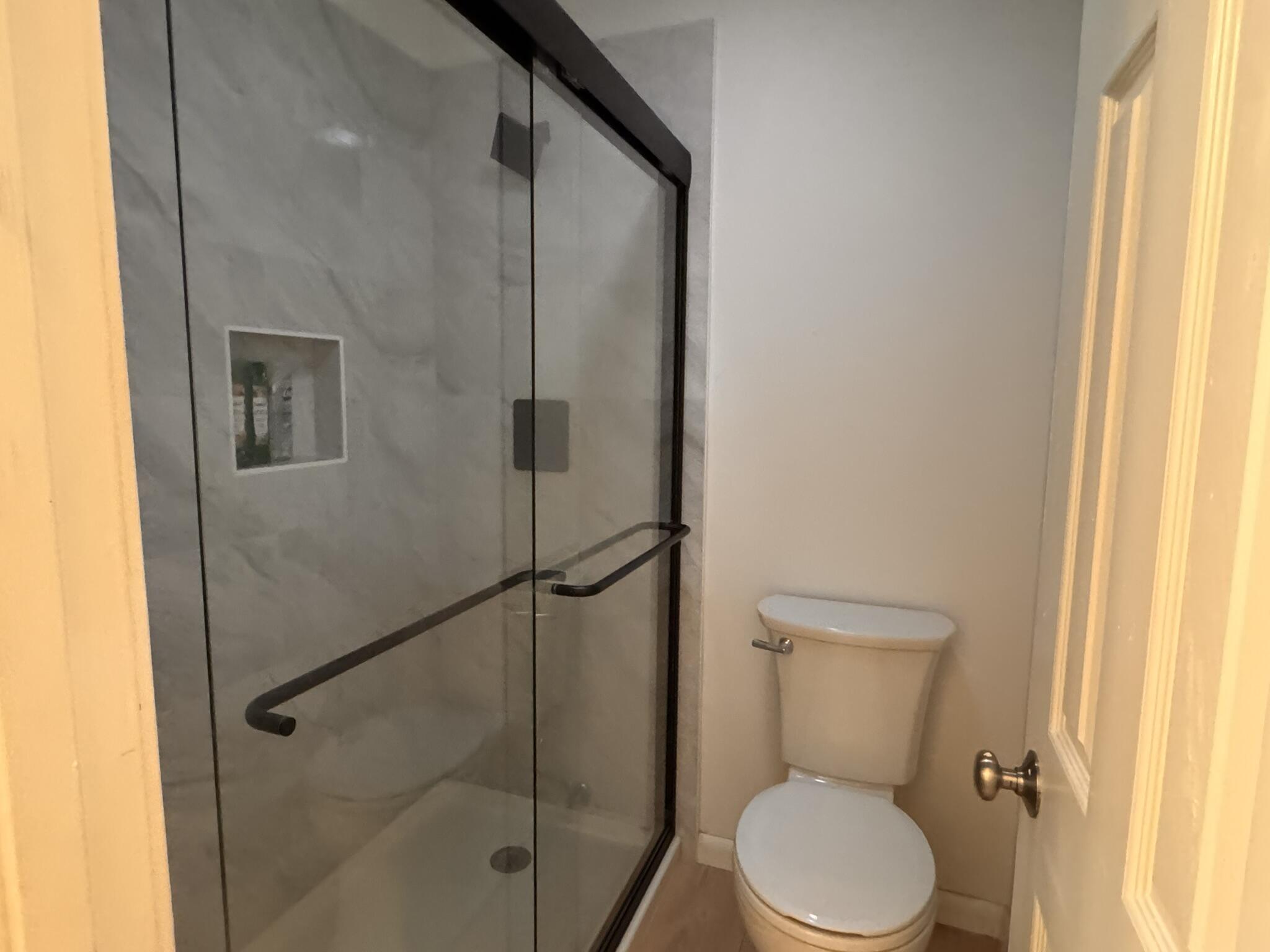 225 SW Meadows, Unit 225 Teaticket, MA 02536 - Photo 14 of 20 a white toilet sitting next to a window