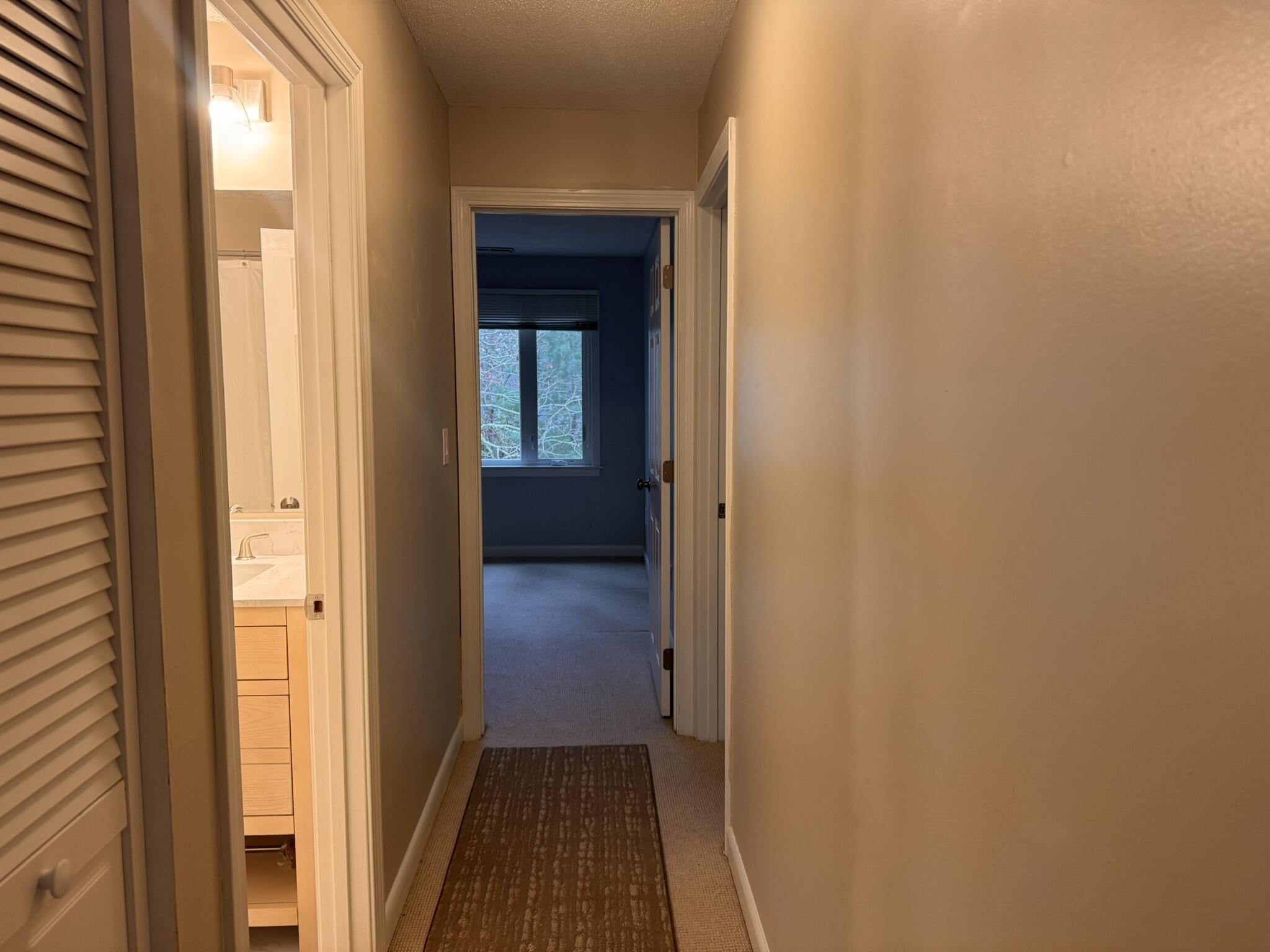 225 SW Meadows, Unit 225 Teaticket, MA 02536 - Photo 15 of 20 a view of a bathroom from a hallway