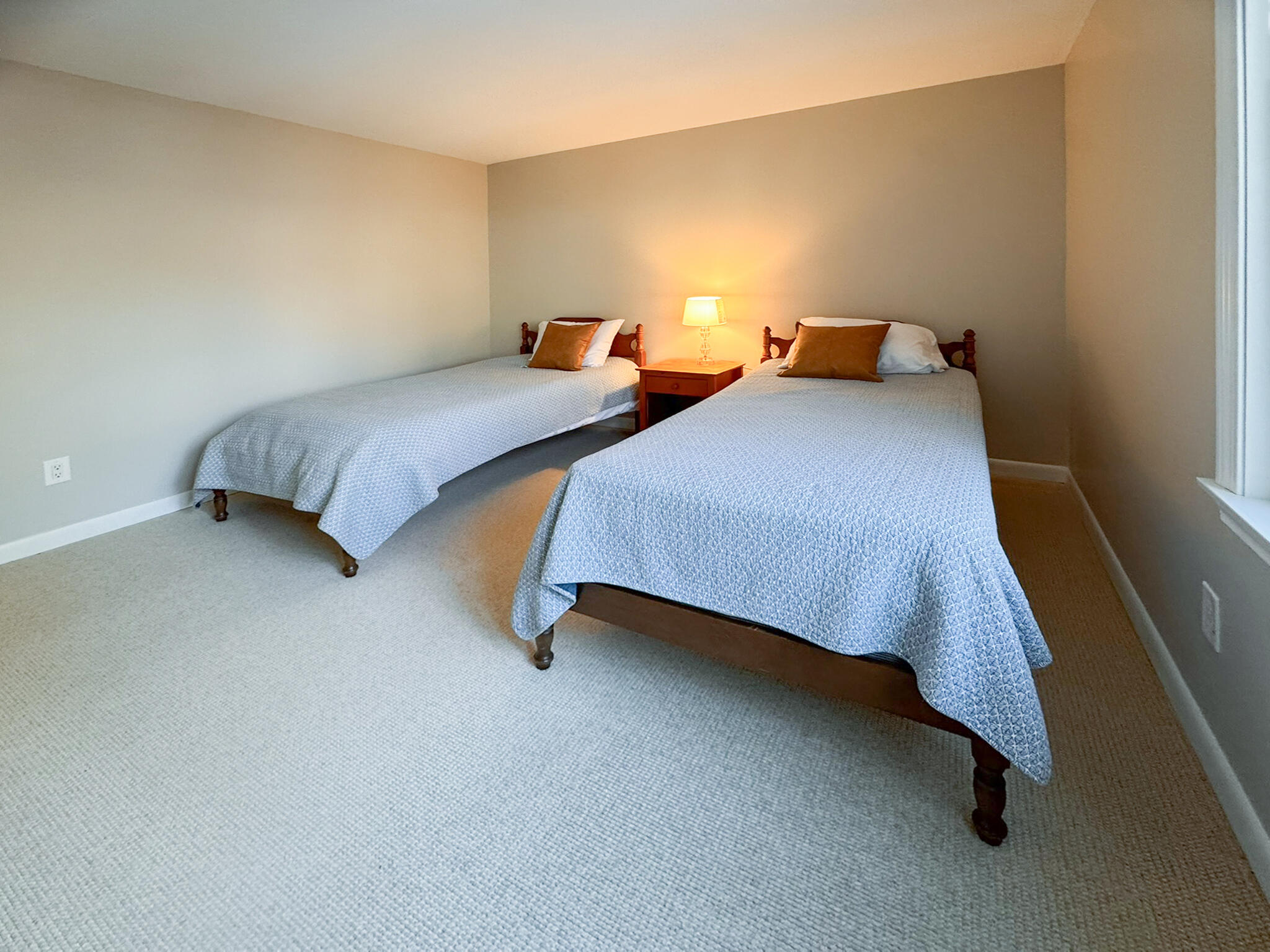 225 SW Meadows, Unit 225 Teaticket, MA 02536 - Photo 16 of 27 a bedroom with 2 bed and lamp