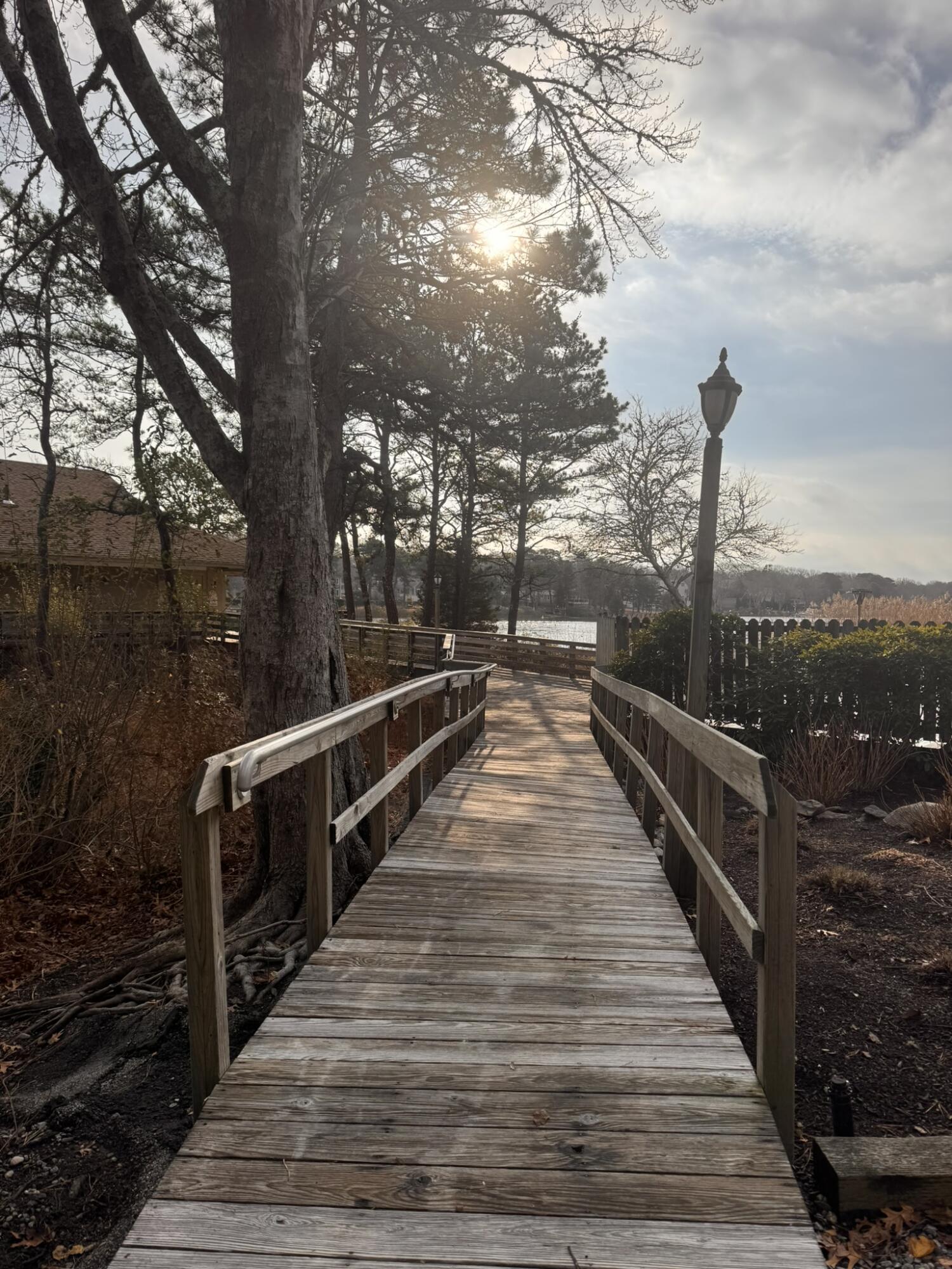 225 SW Meadows, Unit 225 Teaticket, MA 02536 - Photo 16 of 20 a view of balcony and deck with wooden floor and fence