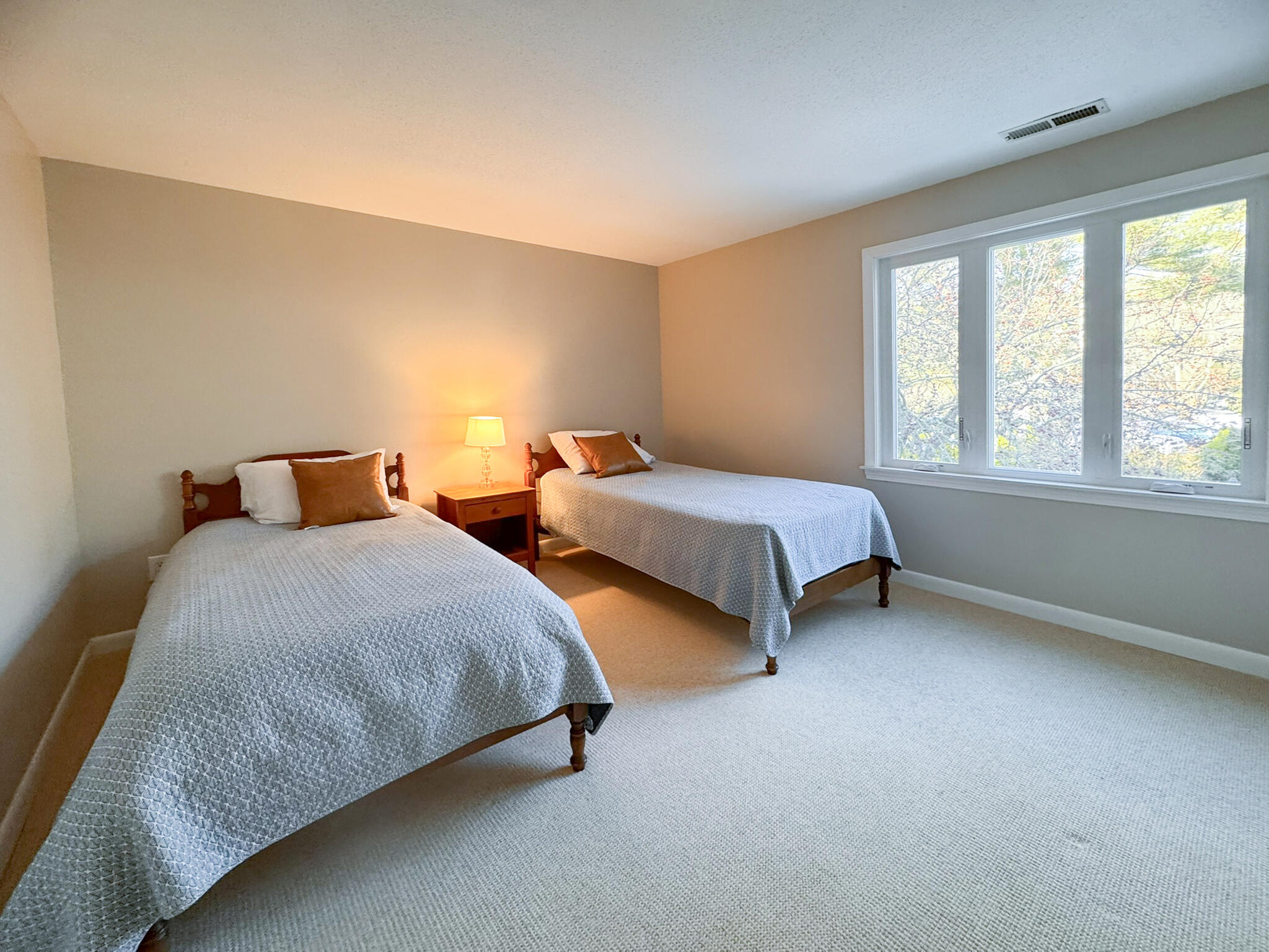 225 SW Meadows, Unit 225 Teaticket, MA 02536 - Photo 17 of 27 a bedroom with two beds and a window