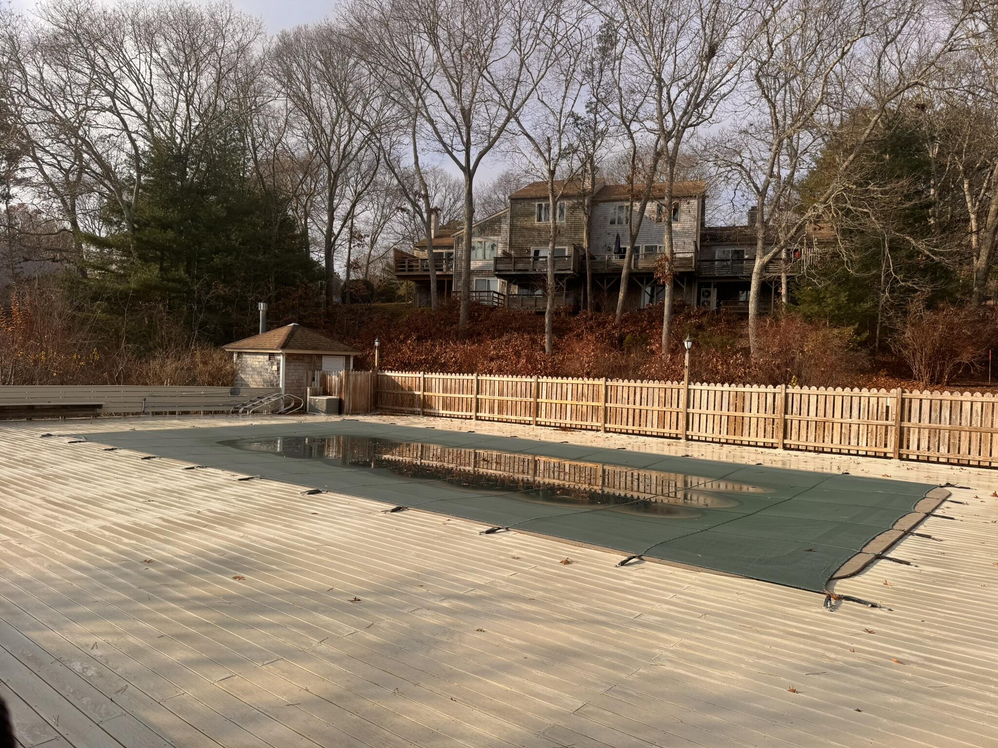 225 SW Meadows, Unit 225 Teaticket, MA 02536 - Photo 17 of 20 a view of a swimming pool with a bench