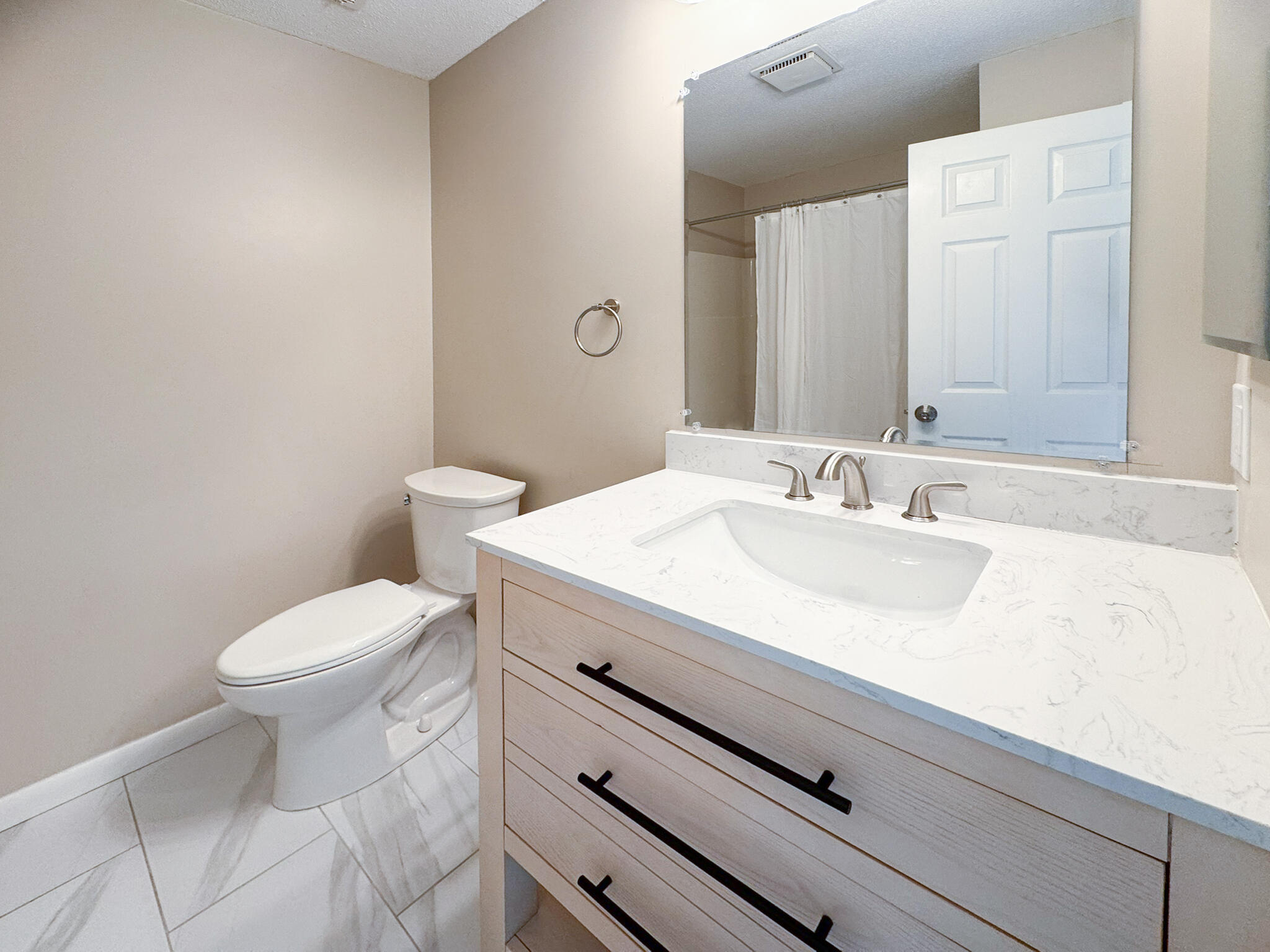225 SW Meadows, Unit 225 Teaticket, MA 02536 - Photo 18 of 27 a bathroom with a sink a toilet and a mirror