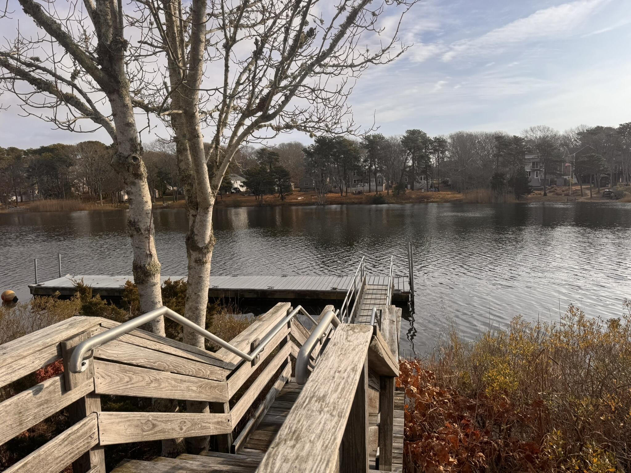 225 SW Meadows, Unit 225 Teaticket, MA 02536 - Photo 20 of 20 a view of a lake with a house