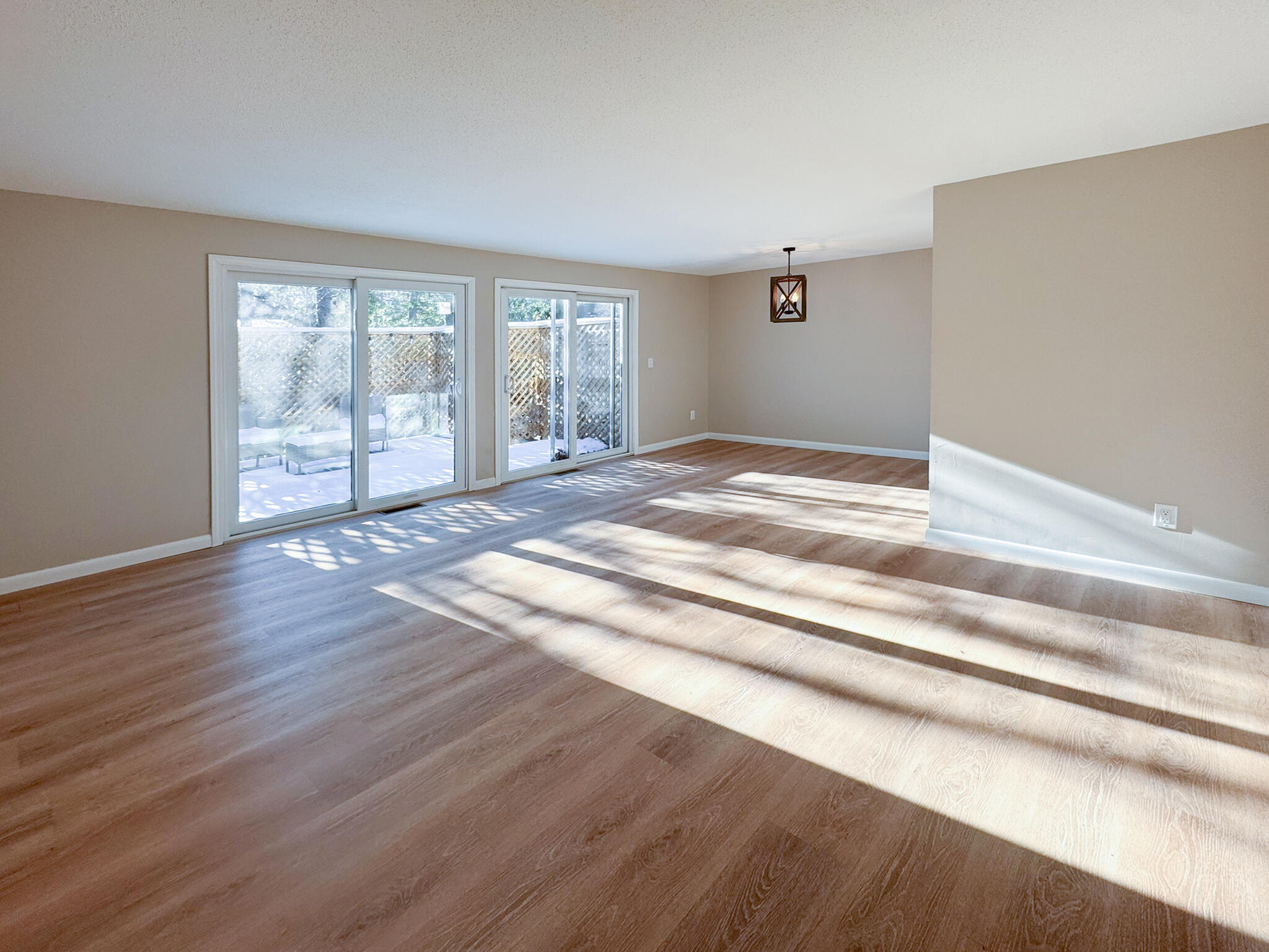 225 SW Meadows, Unit 225 Teaticket, MA 02536 - Photo 2 of 27 a view of empty room with wooden floor and fan