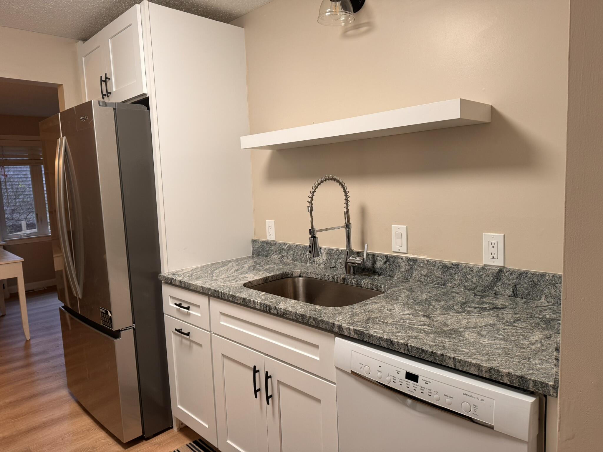 225 SW Meadows, Unit 225 Teaticket, MA 02536 - Photo 4 of 20 a kitchen with sink cabinets and refrigerator