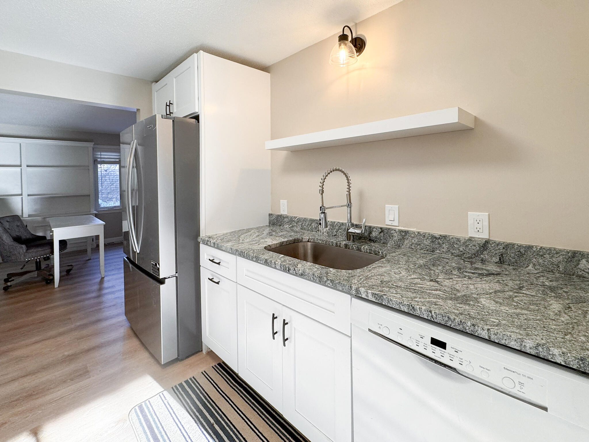225 SW Meadows, Unit 225 Teaticket, MA 02536 - Photo 6 of 27 a kitchen with stainless steel appliances granite countertop a refrigerator and a sink
