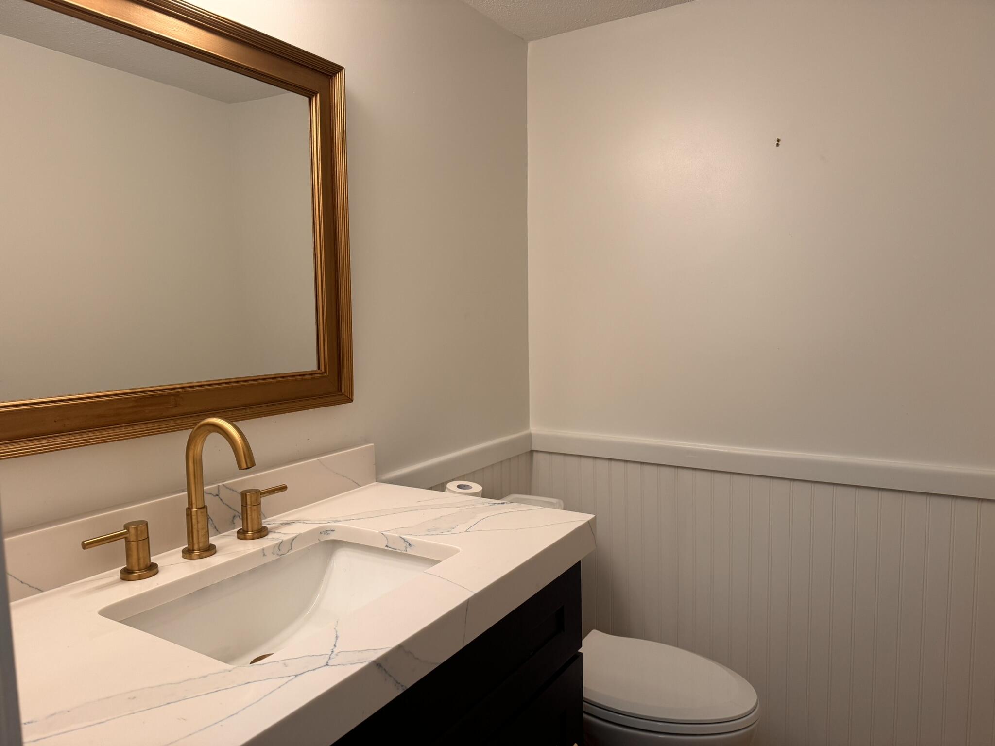225 SW Meadows, Unit 225 Teaticket, MA 02536 - Photo 8 of 20 a bathroom with a sink and a toilet
