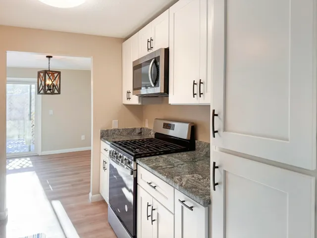 a view of a swimming pool with a bench