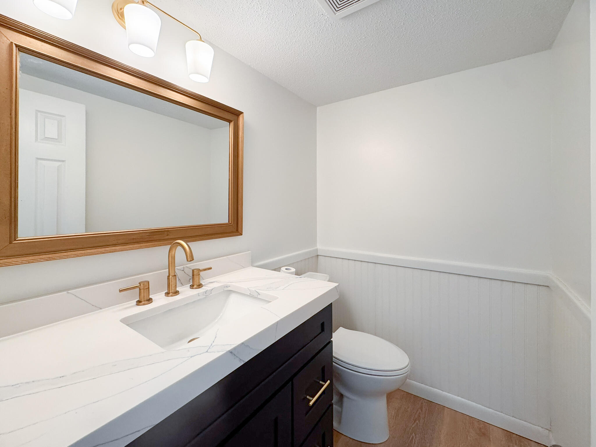 225 SW Meadows, Unit 225 Teaticket, MA 02536 - Photo 9 of 27 a bathroom with a sink vanity mirror and toilet