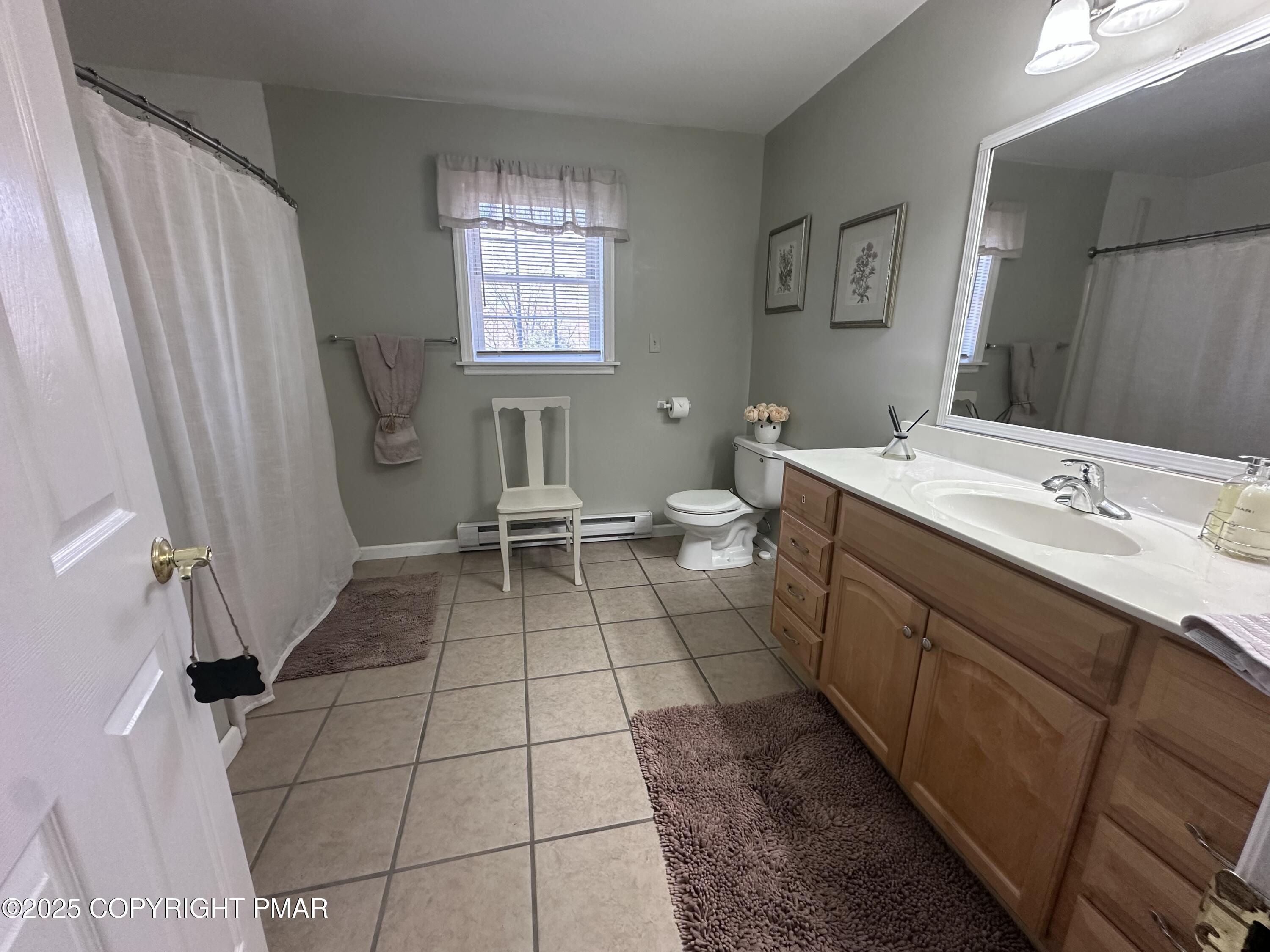 5158 Spring Drive Swiftwater, PA 18370 - Photo 13 of 26 a room with a sink a toilet and a mirror