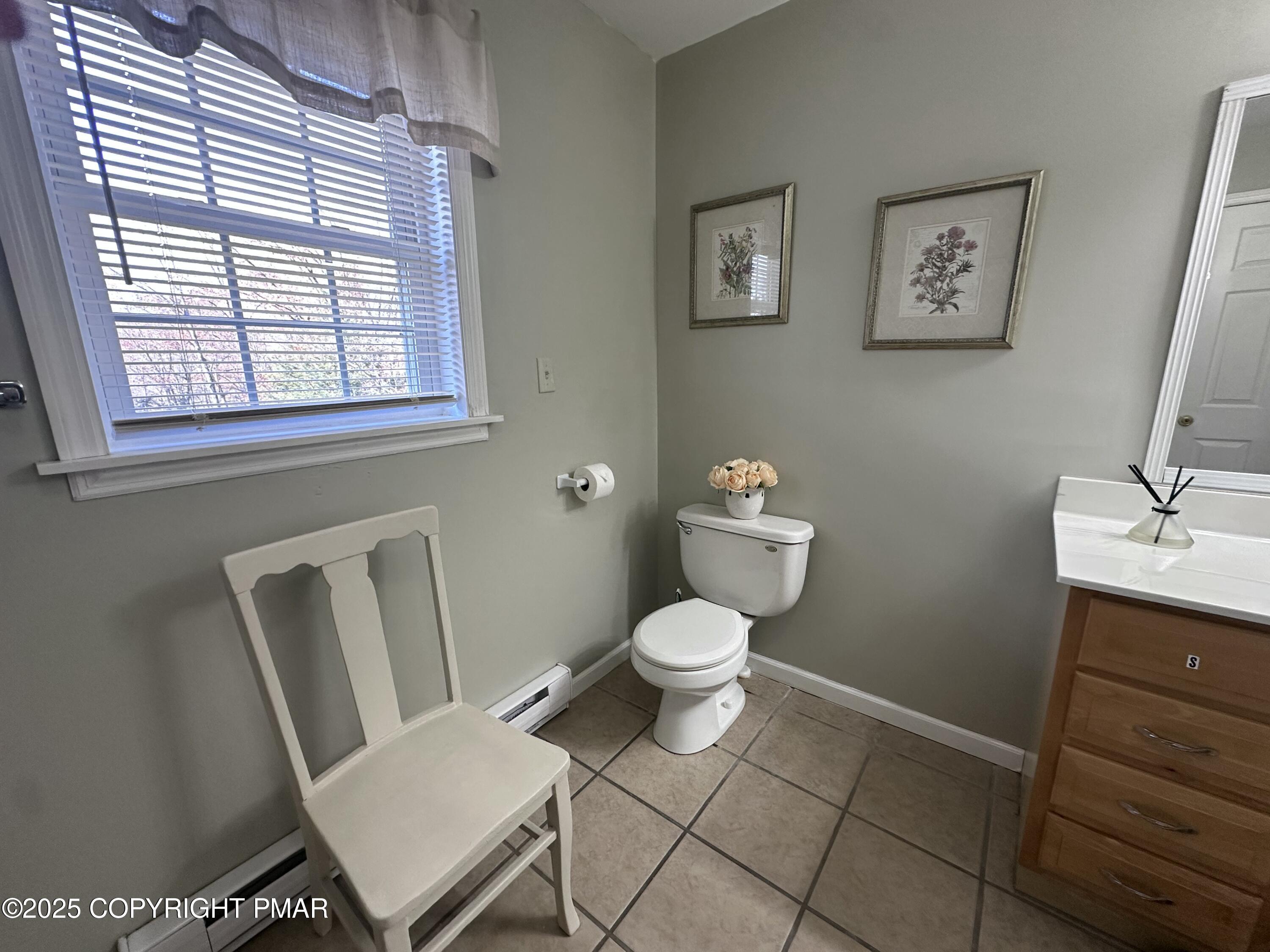 5158 Spring Drive Swiftwater, PA 18370 - Photo 18 of 26 a white toilet sitting next to a bathroom sink