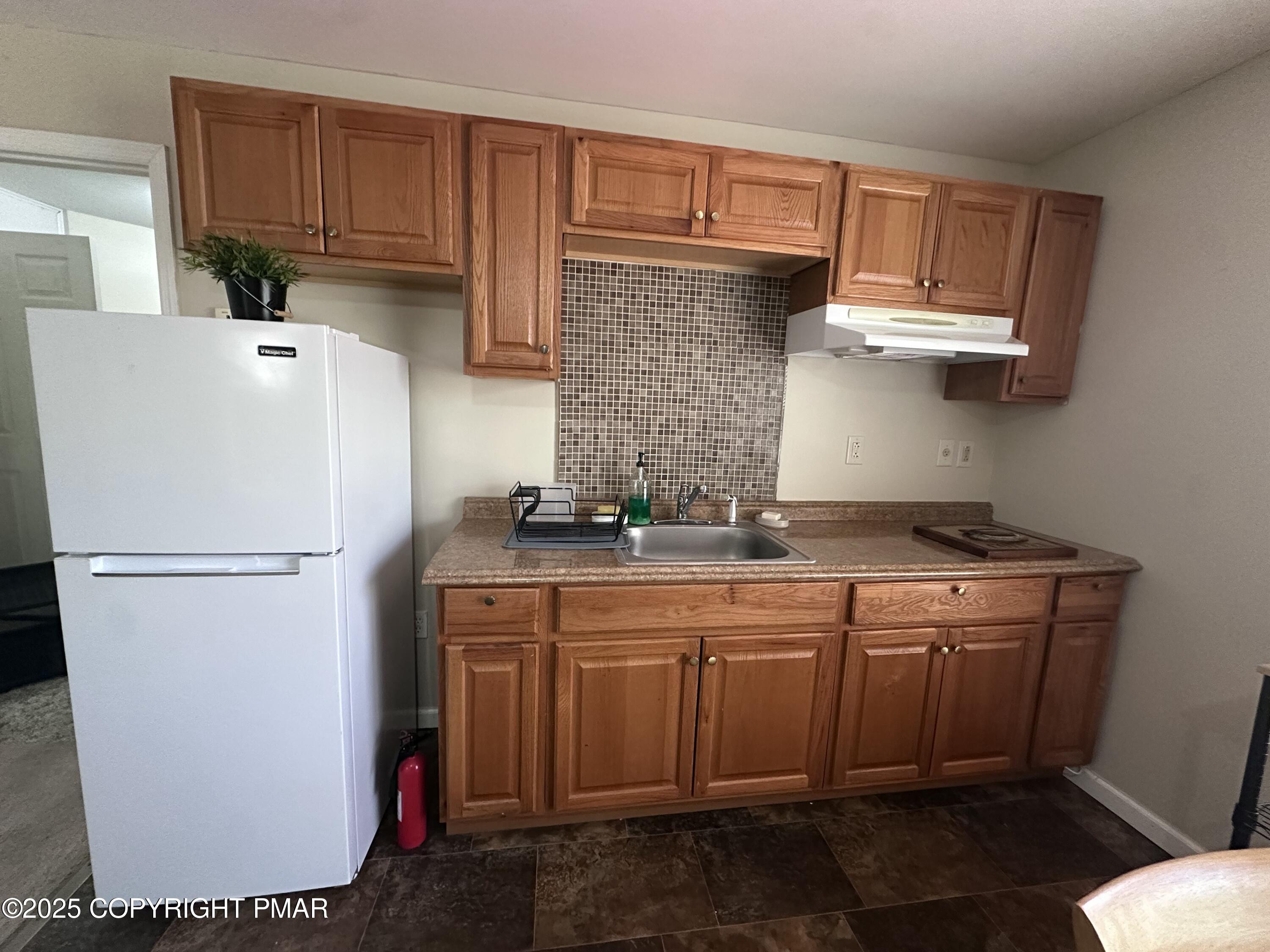 5158 Spring Drive Swiftwater, PA 18370 - Photo 4 of 26 a white refrigerator freezer sitting inside of a kitchen