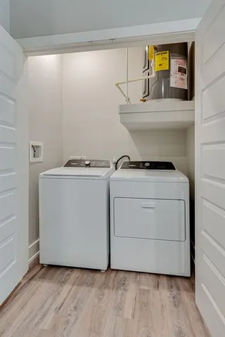 a utility room with washer and dryer