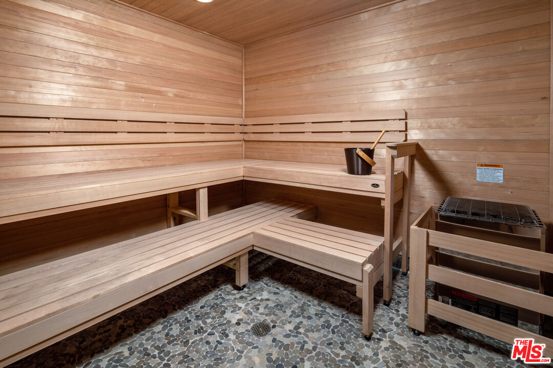 750 South Oxford Avenue, Unit 377 Los Angeles, CA 90005 - Photo 13 of 26 a view of a room with wooden floor and furniture