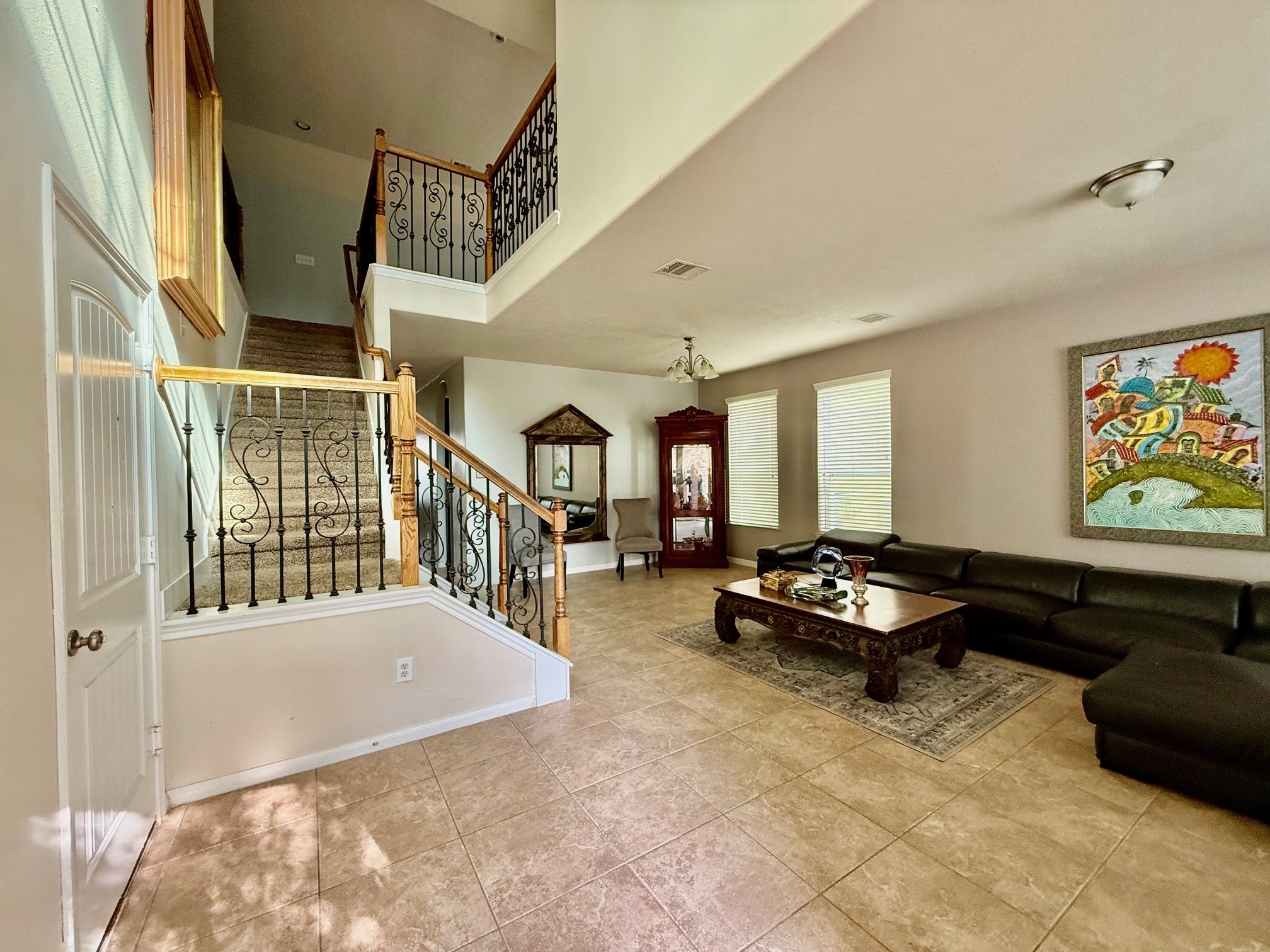 24906 Clover Ranch Drive Katy, TX 77494 - Photo 3 of 13 a living room with furniture stairs and a window