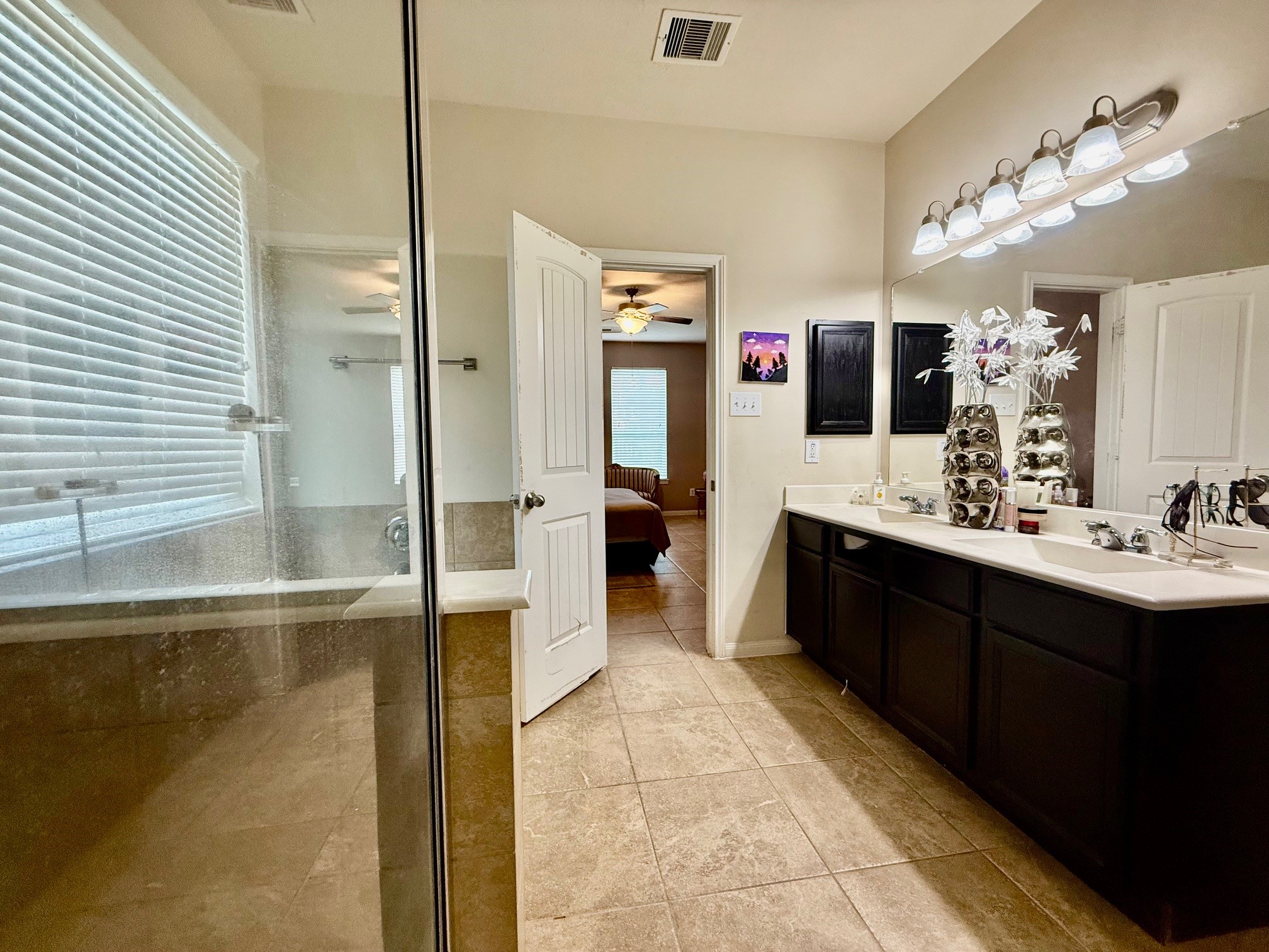 24906 Clover Ranch Drive Katy, TX 77494 - Photo 10 of 13 a spacious bathroom with a bathtub sink and mirror