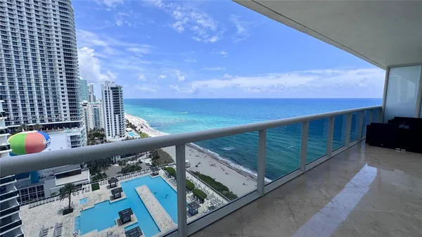 a view of balcony with furniture