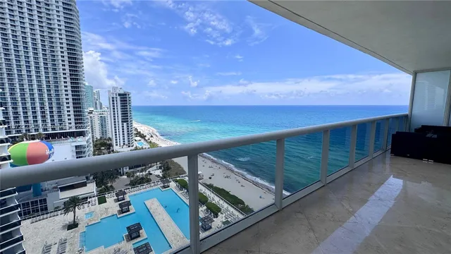 a view of balcony with furniture