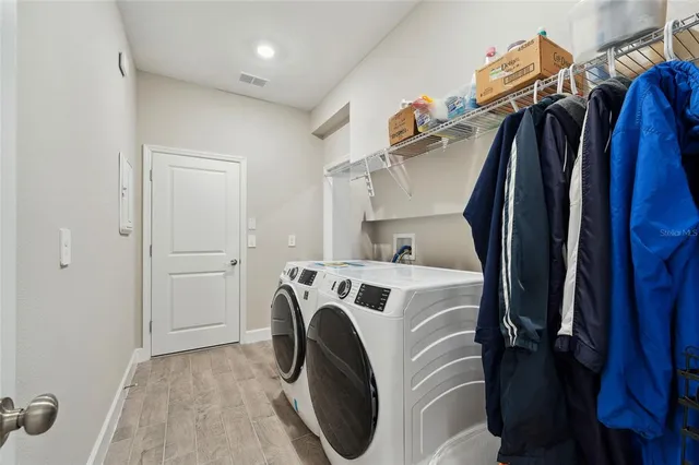 a utility room with dryer and washer