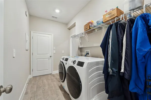 a utility room with dryer and washer