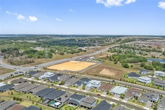 an aerial view of residential houses with outdoor space