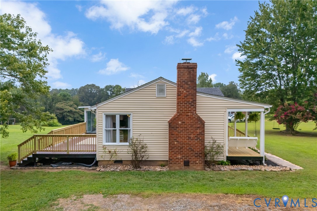 3287 Three Chopt Road Gum Spring, VA 23065 - Photo 41 of 49 a backyard of a house with potted plants and large tree