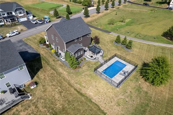 an aerial view of a house with a swimming pool