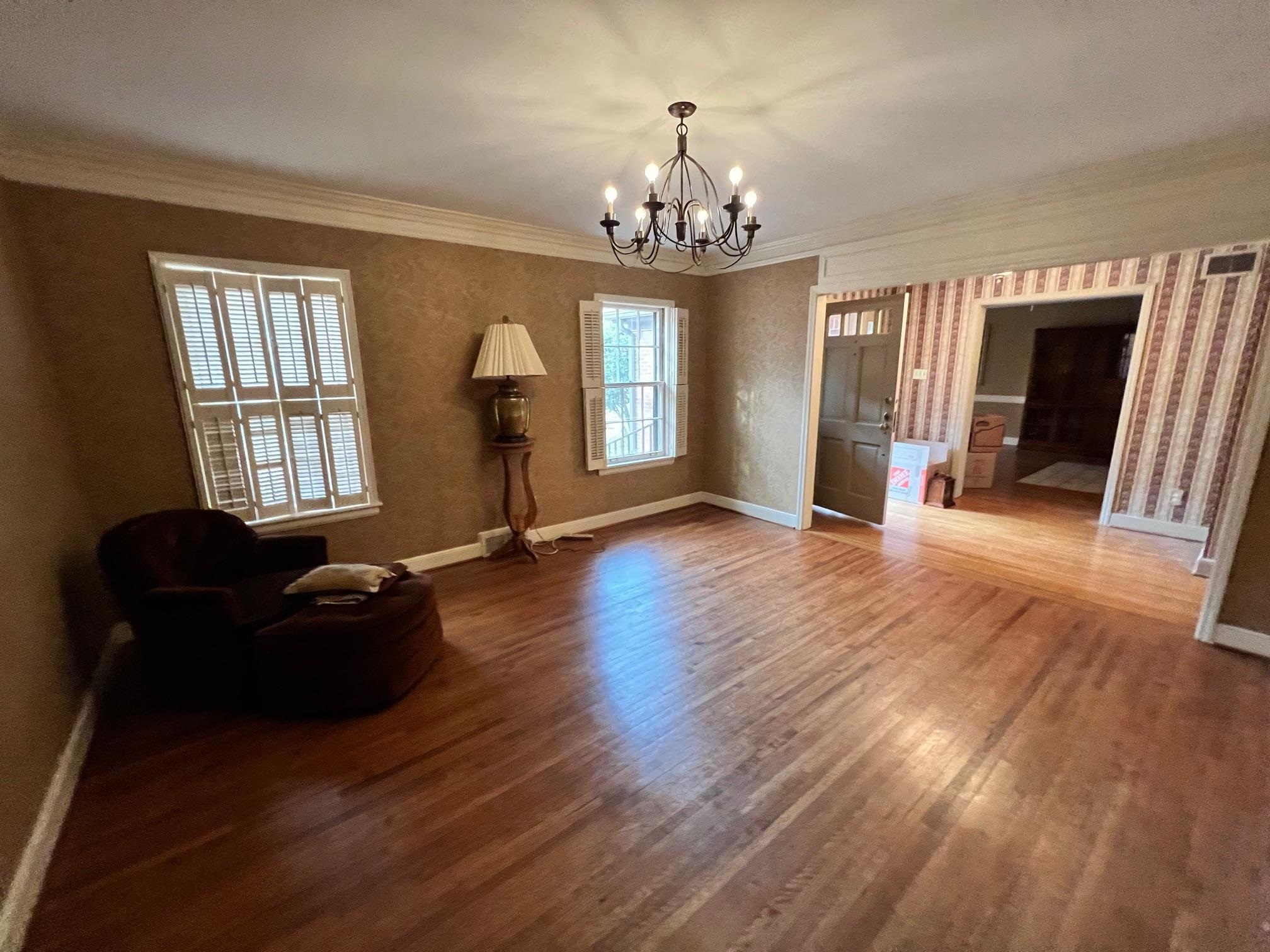 386 Roseland Place Memphis, TN 38111 - Photo 13 of 22 a living room with furniture and a chandelier