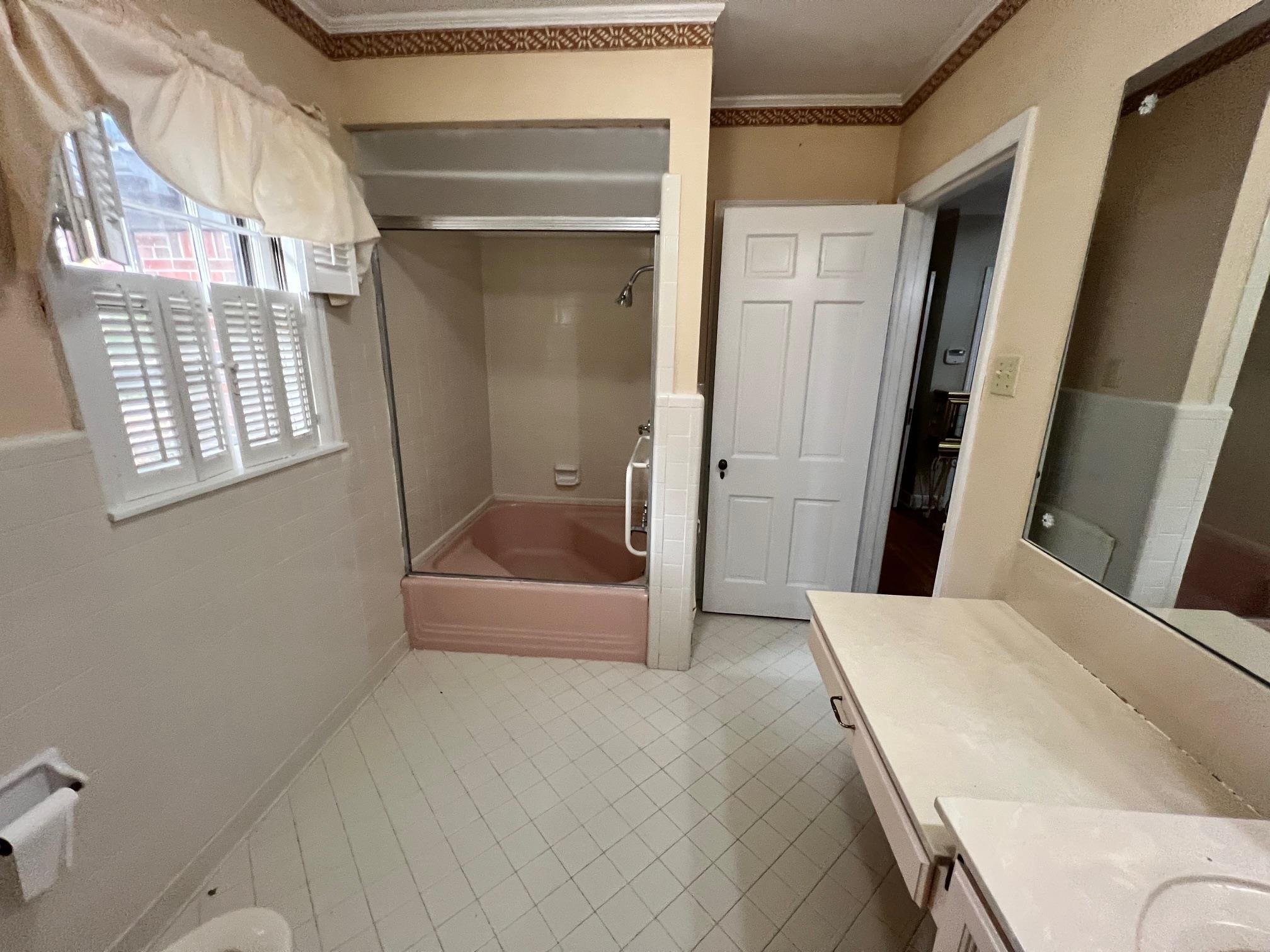 386 Roseland Place Memphis, TN 38111 - Photo 16 of 22 a bathroom with a tub and shower