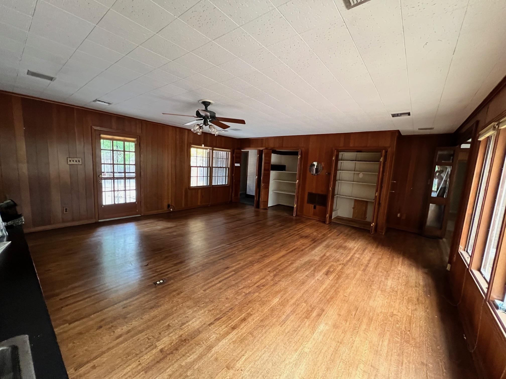 386 Roseland Place Memphis, TN 38111 - Photo 19 of 22 wooden floor in an empty room with a window