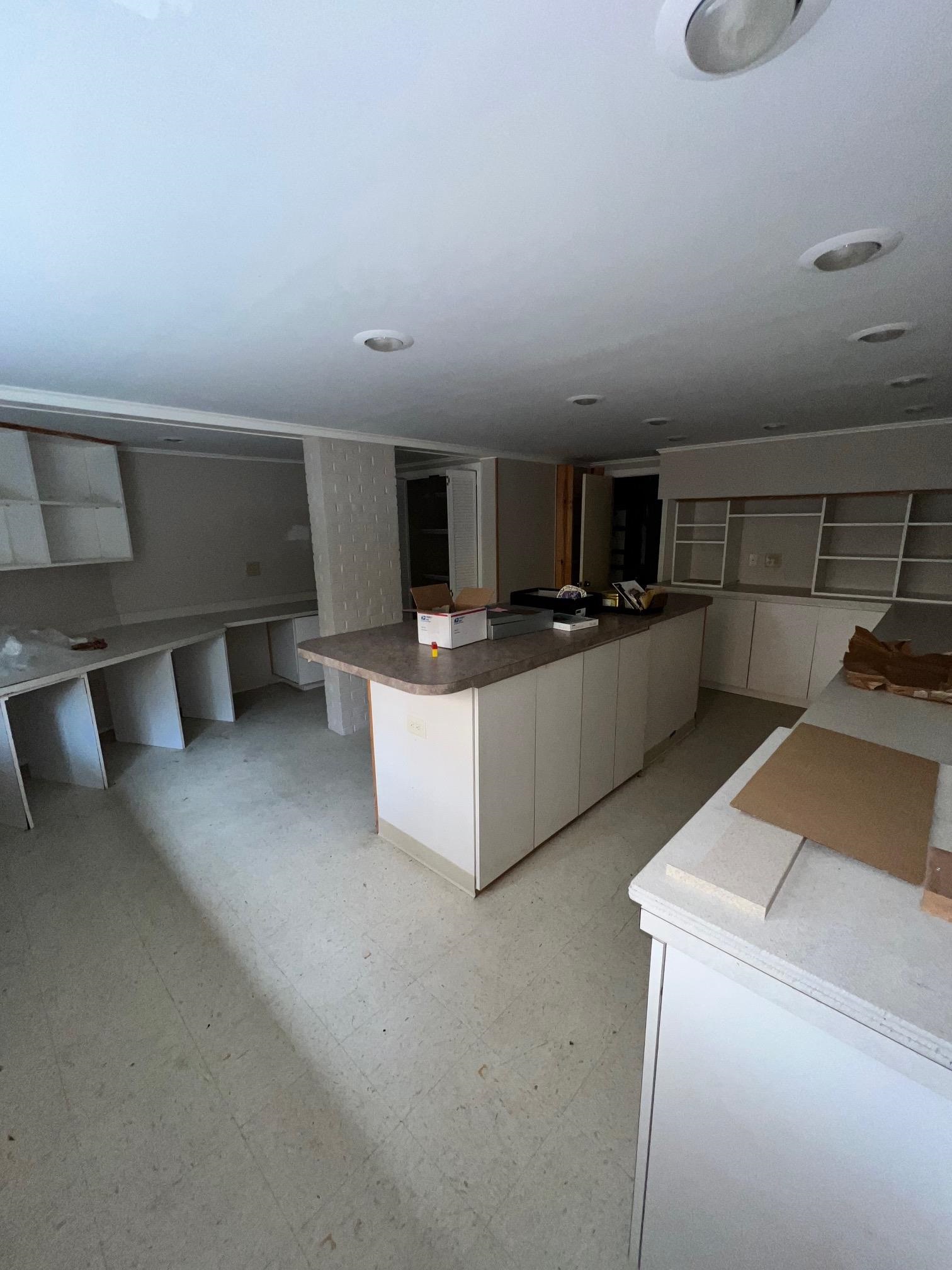 386 Roseland Place Memphis, TN 38111 - Photo 3 of 22 a kitchen with stainless steel appliances a stove a refrigerator a sink a microwave oven with white cabinets