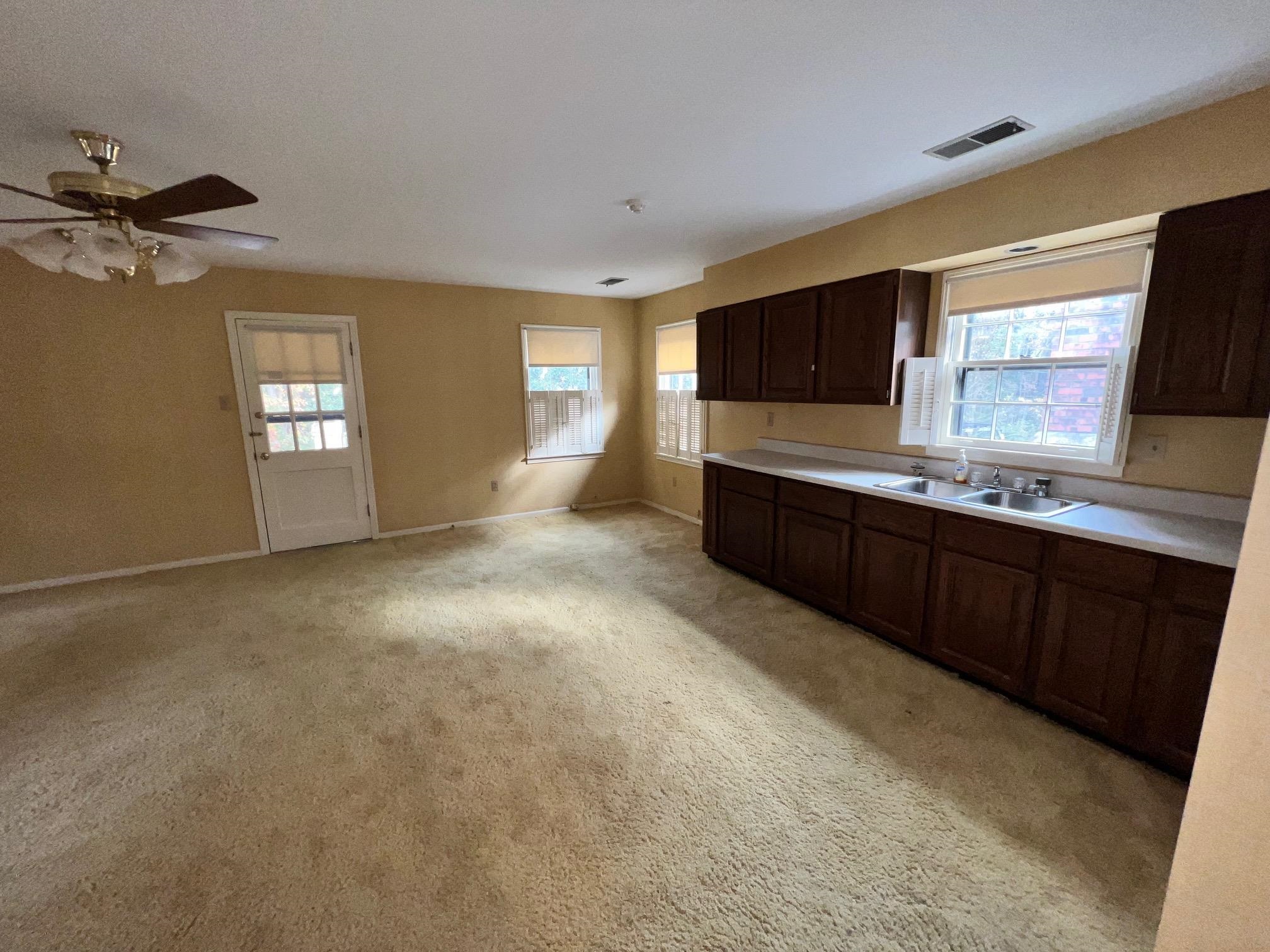 386 Roseland Place Memphis, TN 38111 - Photo 4 of 22 a living room with granite countertop furniture and a flat screen tv