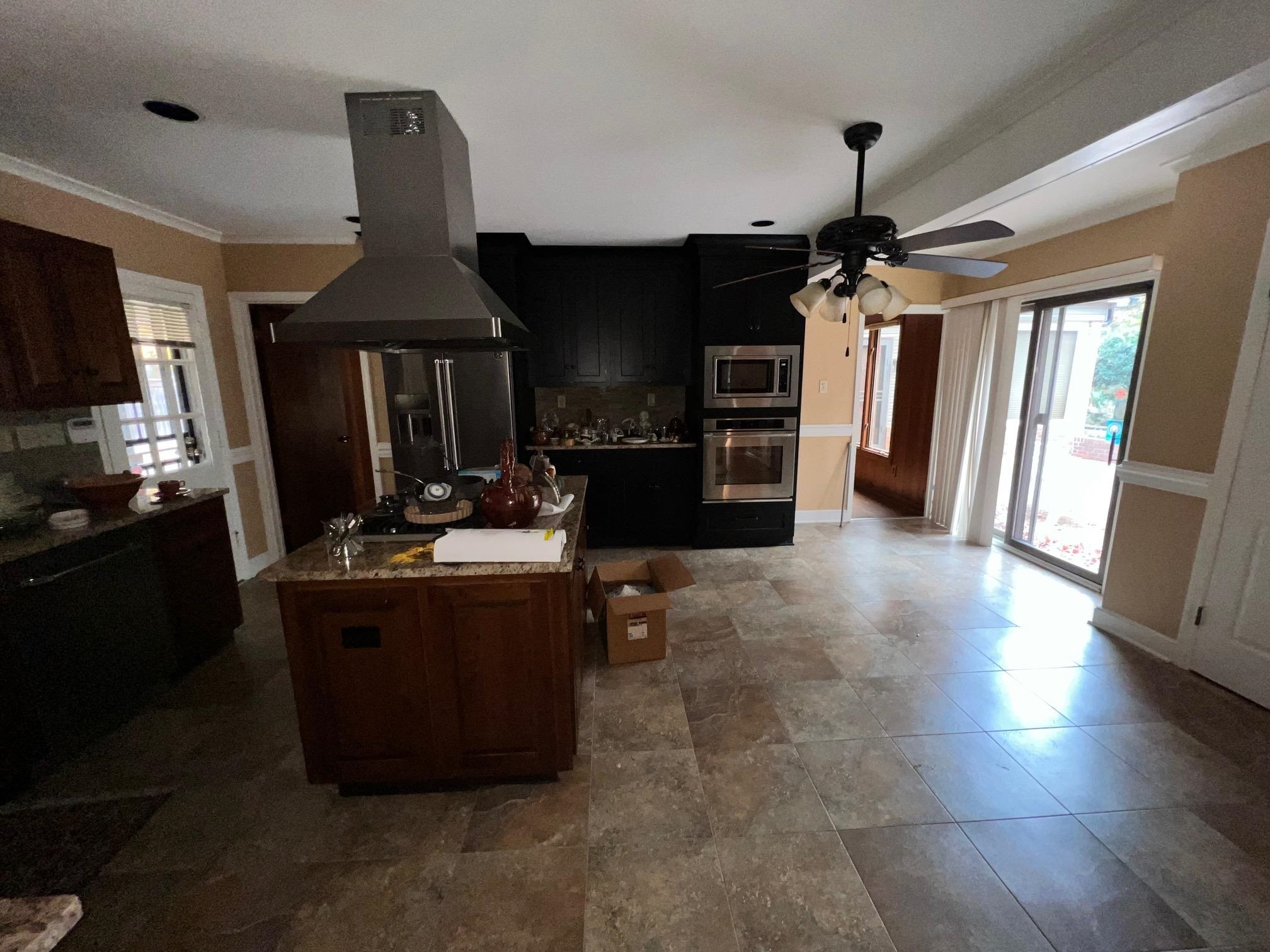 386 Roseland Place Memphis, TN 38111 - Photo 7 of 22 a kitchen with stove and cabinets