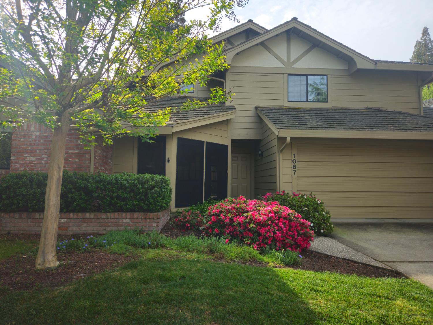 1067 Rio Cidade Way Sacramento, CA 95831 - Photo 3 of 33 a front view of a house with a yard