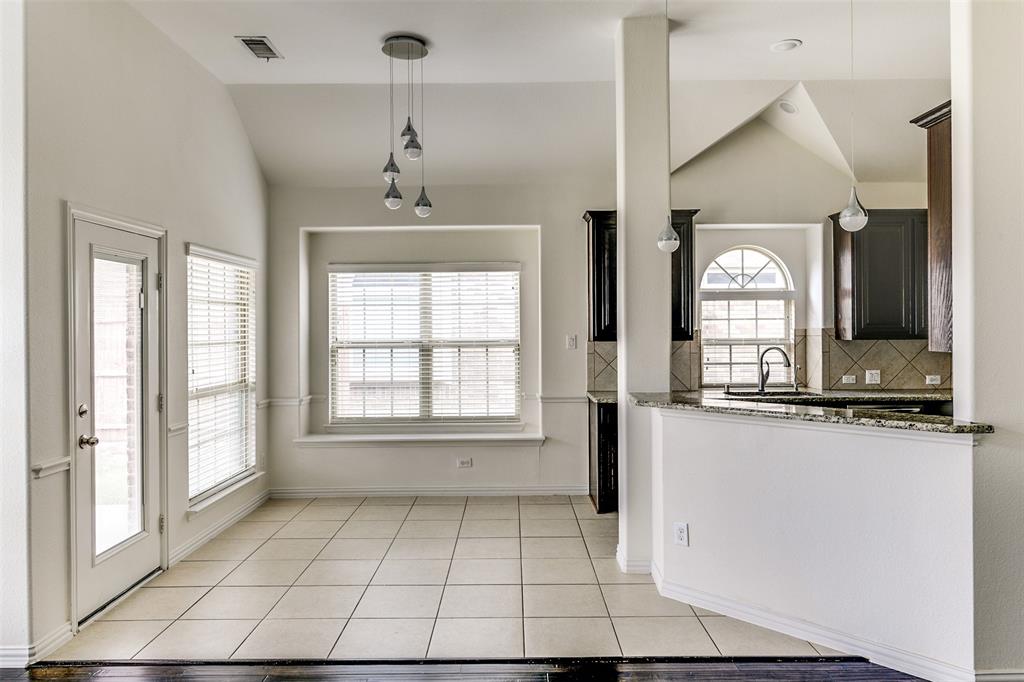 123 Quail Run Road Red Oak, TX 75154 - Photo 12 of 30 a view of a kitchen with a sink and a window