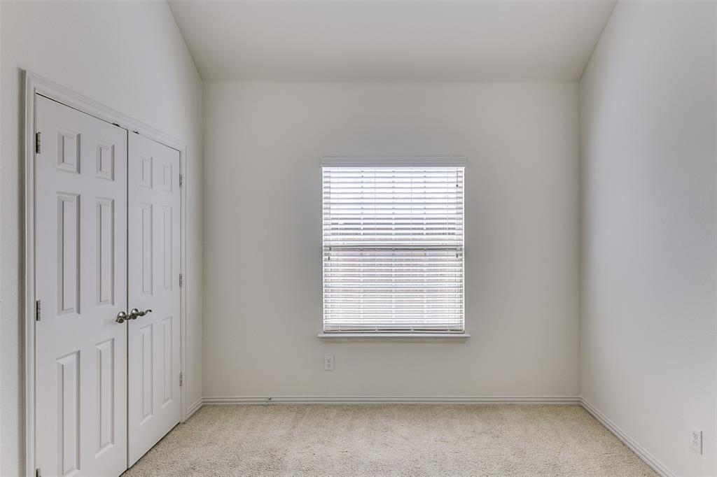 123 Quail Run Road Red Oak, TX 75154 - Photo 25 of 30 a view of an empty room with a window