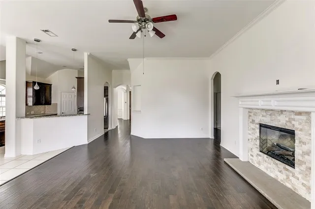 a view of an empty room with a fireplace