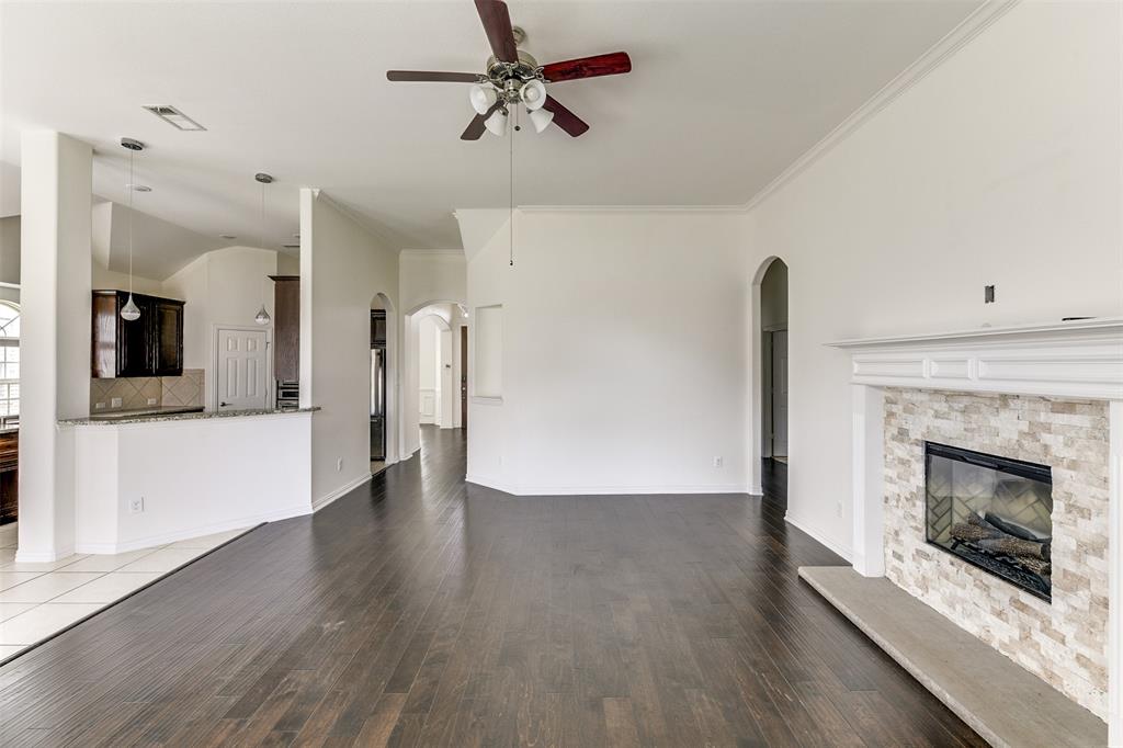 123 Quail Run Road Red Oak, TX 75154 - Photo 8 of 30 a view of an empty room with a fireplace