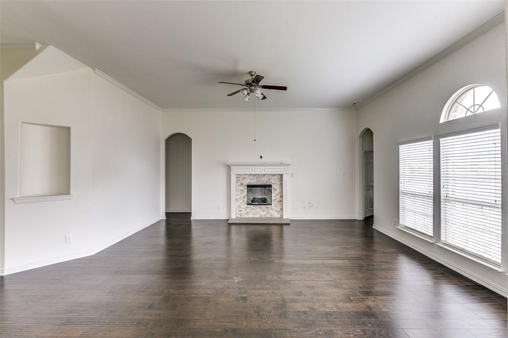 123 Quail Run Road Red Oak, TX 75154 - Photo 9 of 30 an empty room with windows and a fireplace
