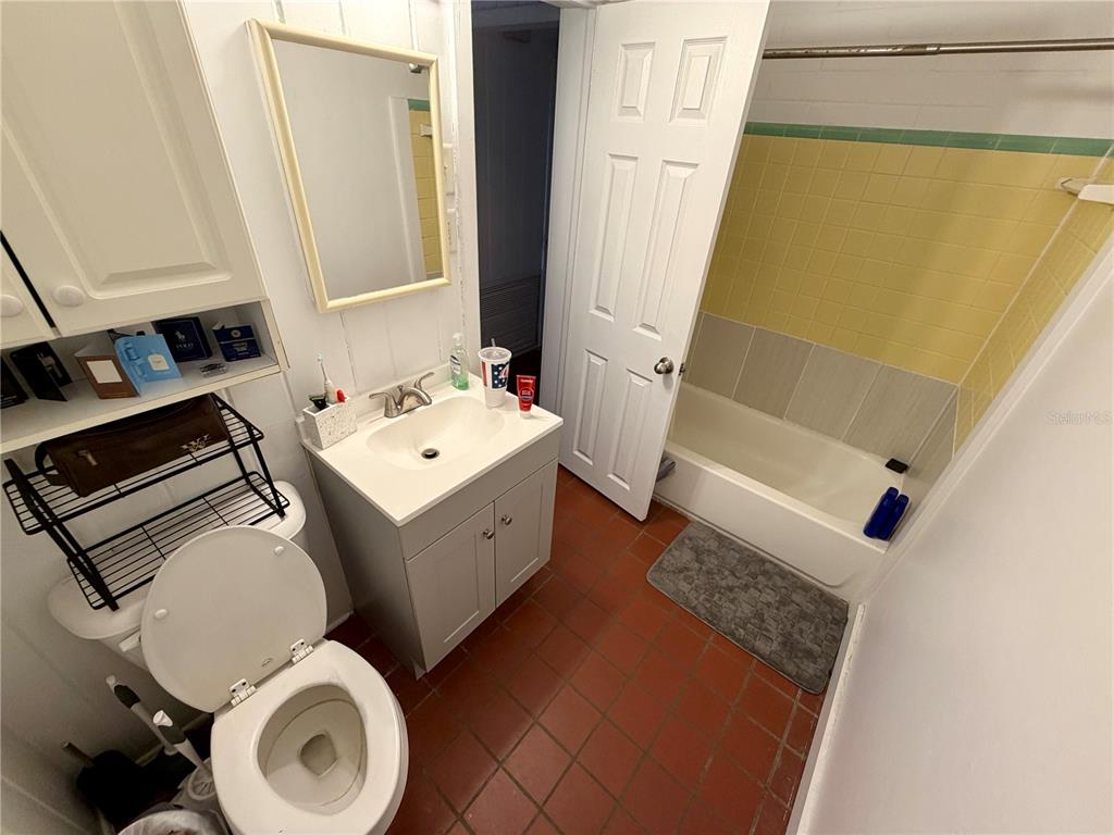 21 Southwest 23rd Terrace Gainesville, FL 32607 - Photo 22 of 23 a bathroom with a sink a toilet and shower