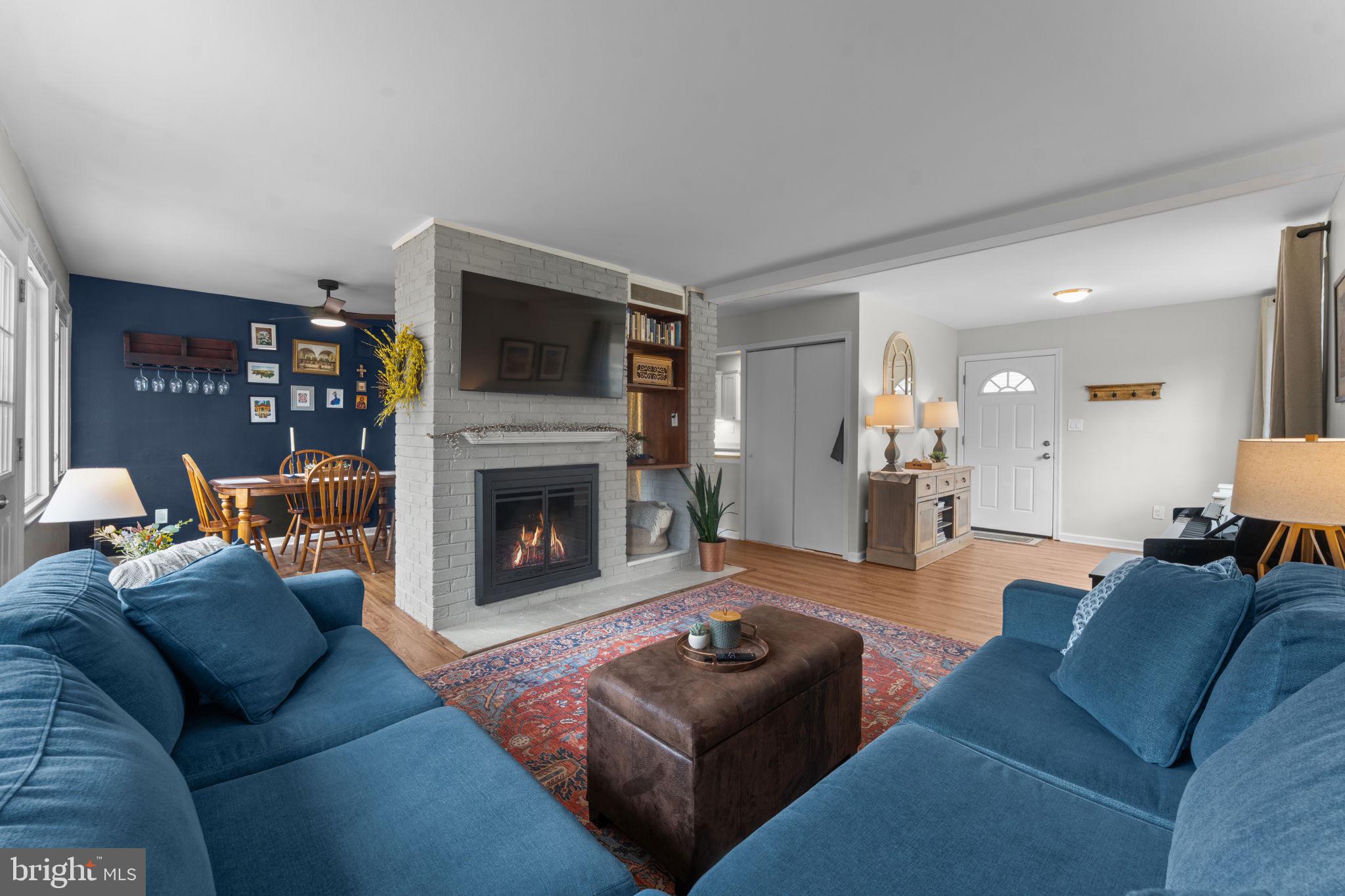 1806 Tilton Drive Silver Spring, MD 20902 - Photo 12 of 54 a living room with furniture and a fireplace