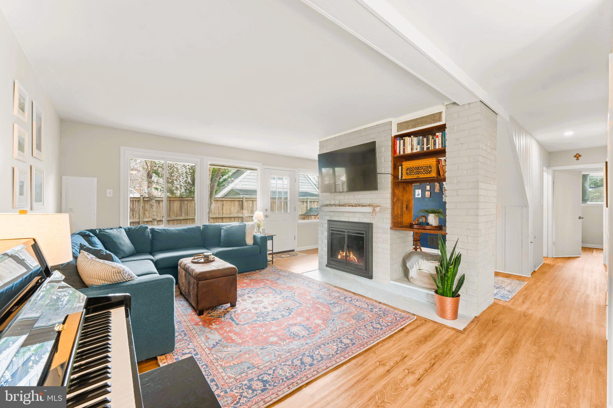 1806 Tilton Drive Silver Spring, MD 20902 - Photo 13 of 54 a living room with furniture and a fireplace