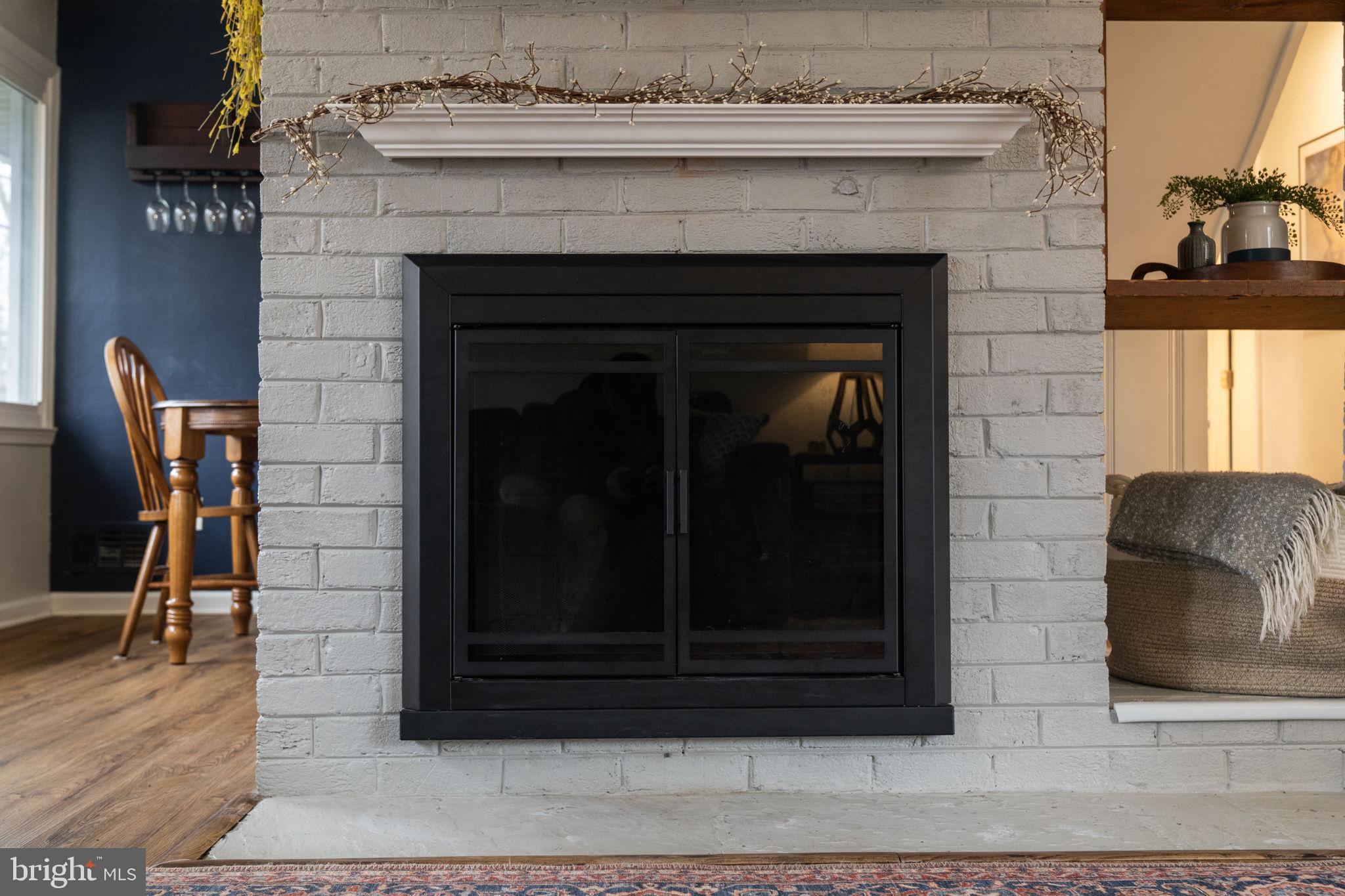 1806 Tilton Drive Silver Spring, MD 20902 - Photo 14 of 54 a living room with a fireplace